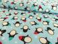 Preview: Patchworkstoff Pinguine mit Mütze auf helltürkis. Von Timeless Treasures.